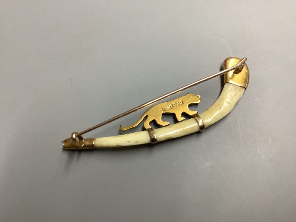 An Indian 14ct and bone mounted 'tiger' set curved brooch, by Hamilton & Co, in original box